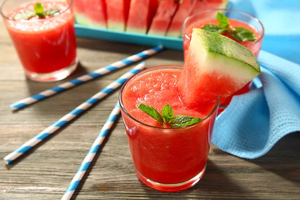 Glasses of watermelon juice on wooden table, closeup — Stock Photo, Image