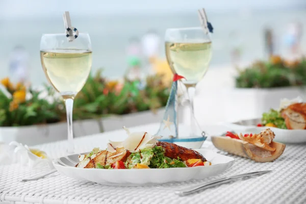 Tasty salad with served wine — Stock Photo, Image