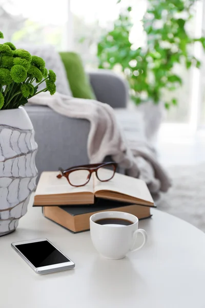 Cup of coffee with books — Stock Photo, Image