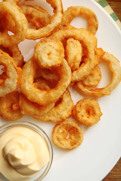 Chips rings with sauce on plate — Stock Photo, Image
