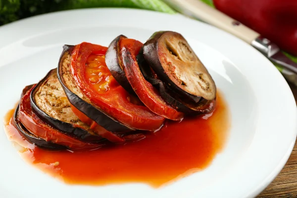 Ratatouille on plate, on table background — Stock Photo, Image