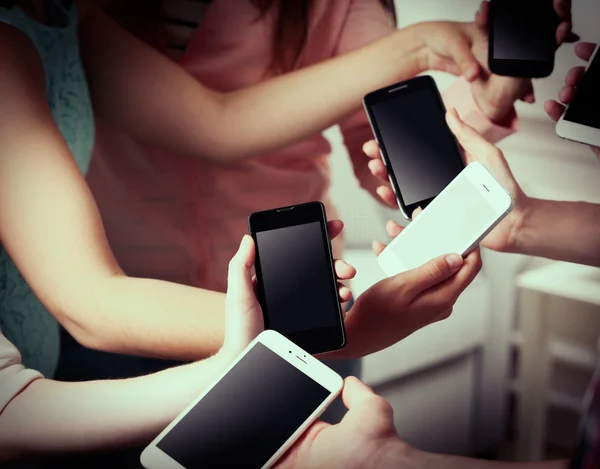 Hands holding mobile phones — Stock Photo, Image