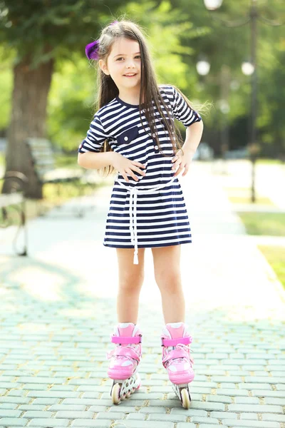 Little girl in striped dress — Stock Photo, Image