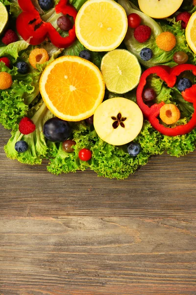 Beautiful bouquet of fruits and vegetables on wooden background, close up — Stock Photo, Image