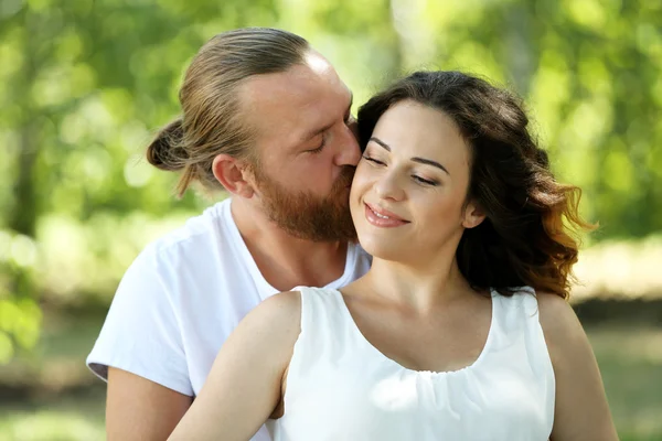 Embracing couple in the park — Stock Photo, Image