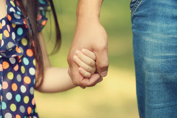 Father's hand lead his child daughter outdoors, trust family concept — Stock Photo, Image