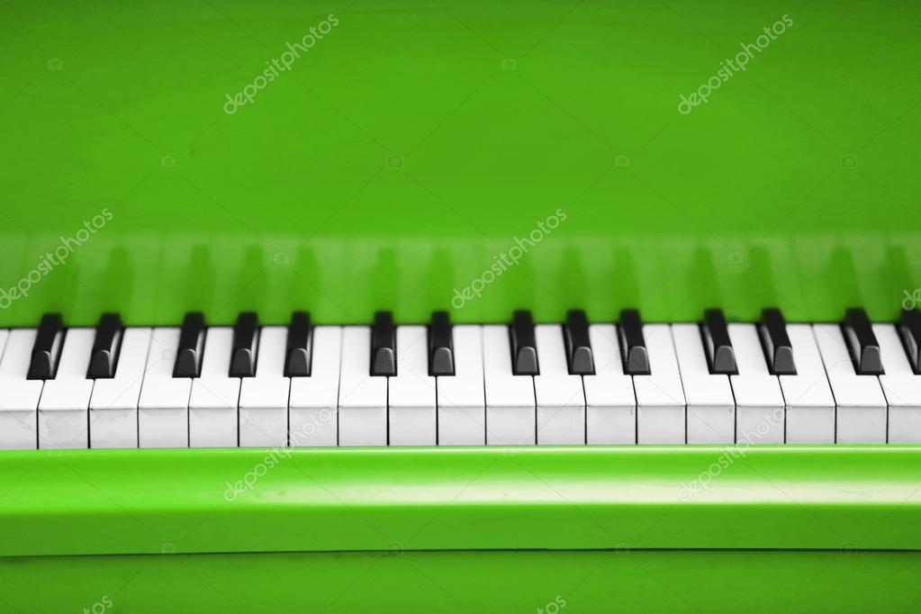 Piano keys of green piano — Stock Photo © belchonock #89070956