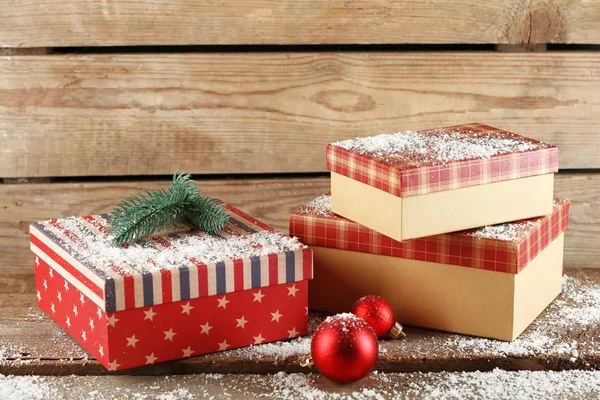 Gift boxes on wooden background — Stock Photo, Image