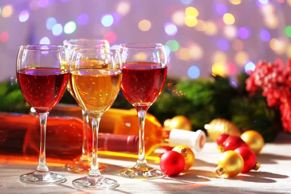 Wine and Christmas decoration on bright background — Stock Photo, Image