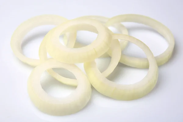 Sliced onion rings isolated on white — Stock Photo, Image