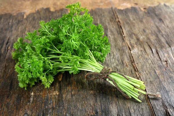 Fresh parsley on wooden background — Stock Photo, Image