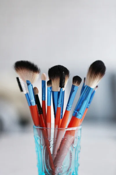 Cosmetic brushes in glass — Stock Photo, Image