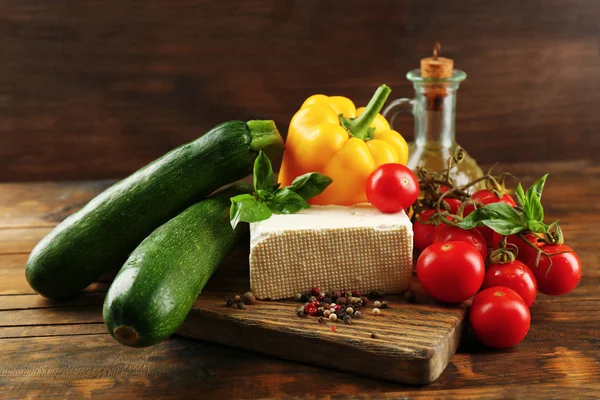 Fresh ingredients for preparing zucchini rolls on wooden background — Stock Photo, Image