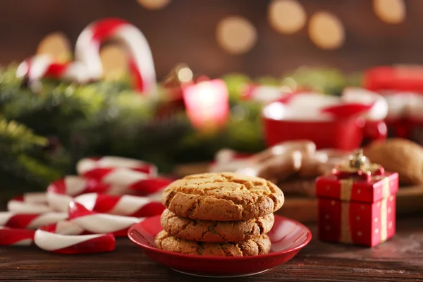 Christmas Candy Canes with Christmas decoration on table on bright background — Stock Photo, Image