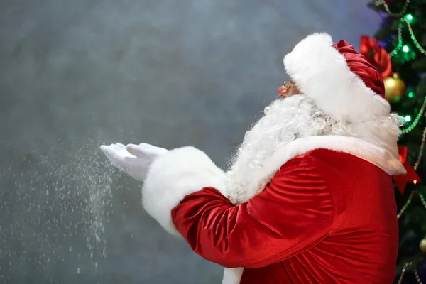 Santa Claus blowing snow — Stock Photo, Image
