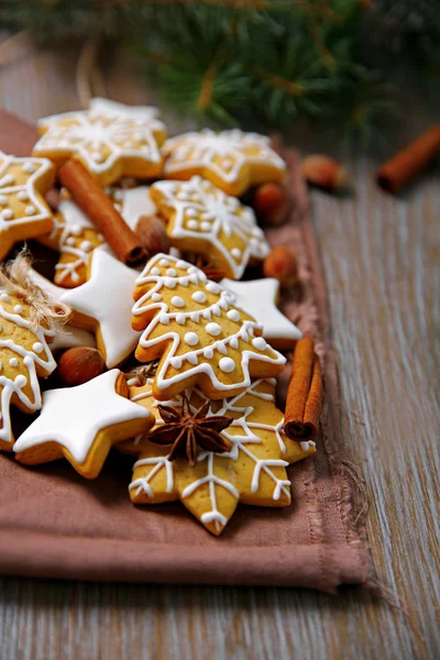 Christmas cookies with spices on wooden table — Stock Photo, Image