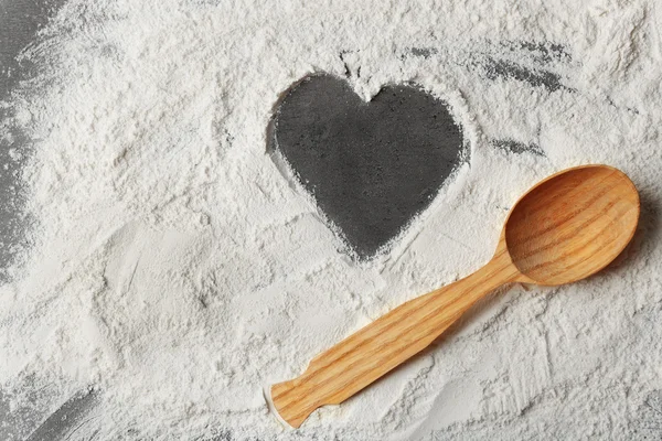 Heart of flour on gray background — Stock Photo, Image