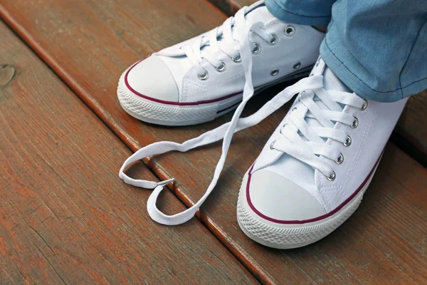 Pés em sapatos de goma — Fotografia de Stock