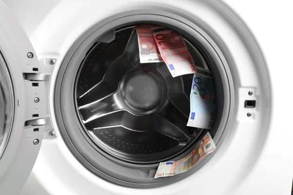 Geld in de wasmachine — Stockfoto