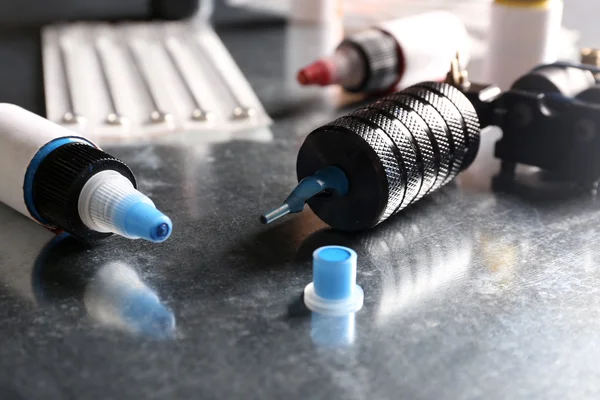 Tattoo machine with colourful ink — Stock Photo, Image