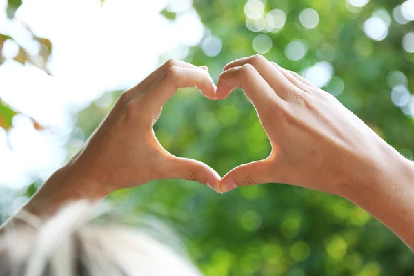 Hands in shape of love heart — Stock Photo, Image