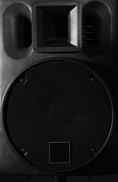 Big black loudspeaker on black background, close up