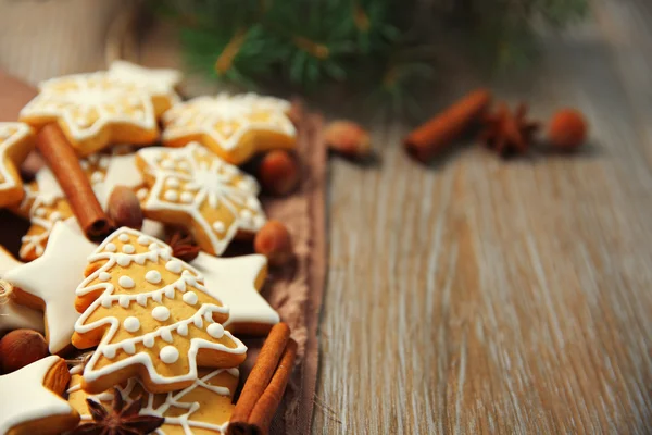 Christmas cookies with spices on wooden table — Stock Photo, Image