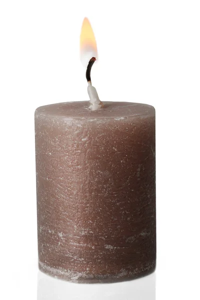 Alight wax grey candle on light background — Stock Photo, Image