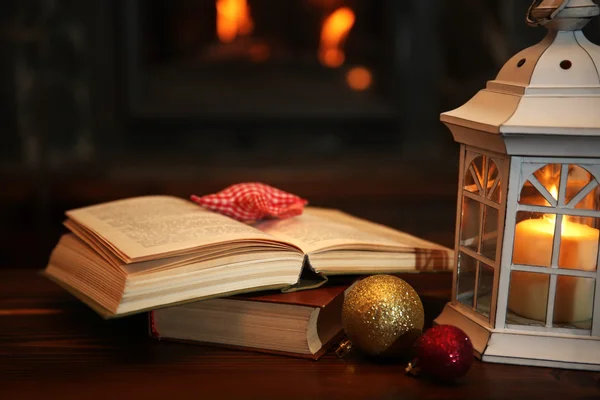 Book and candles on vintage table — Stock Photo, Image