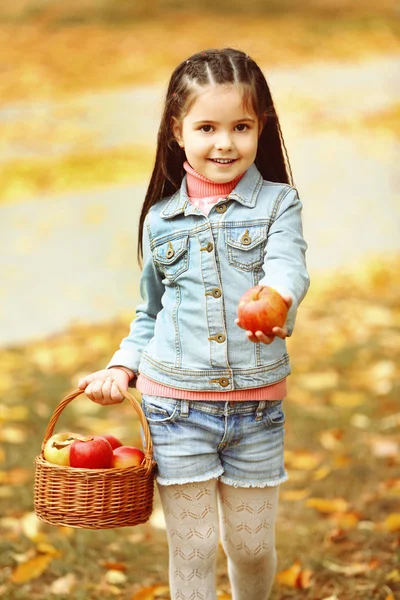 Beautiful little girl with apples — Stock Photo, Image