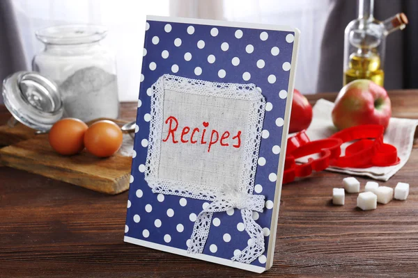 Recipe book and ingredients for cooking — Stock Photo, Image