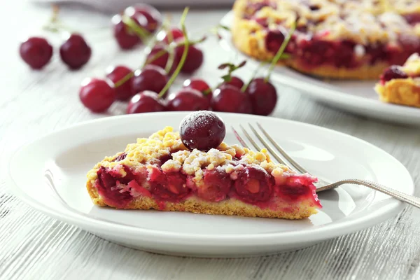 Tasty homemade pie with cherries on table close up — Stock Photo, Image