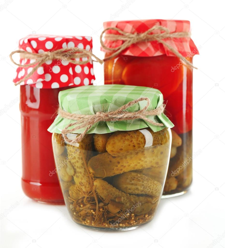 Jars  with pickled vegetables isolated on white