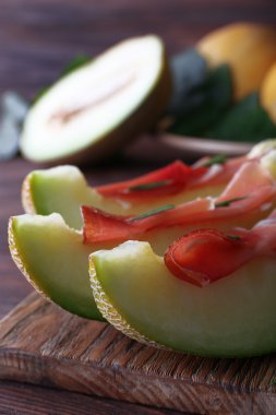 Parma ham ahşap tablo, closeup prosciutto ile kavun