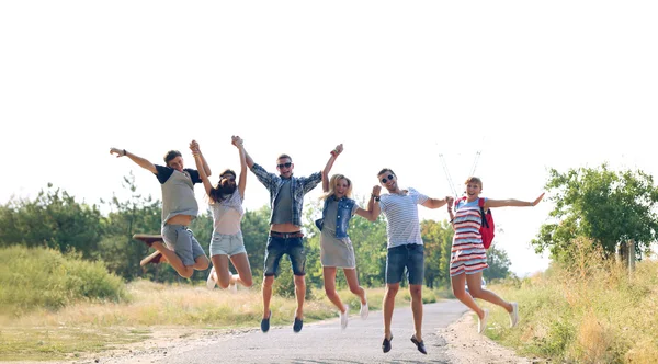 Happy Friends Jumping Together Outdoors — Stock Photo, Image