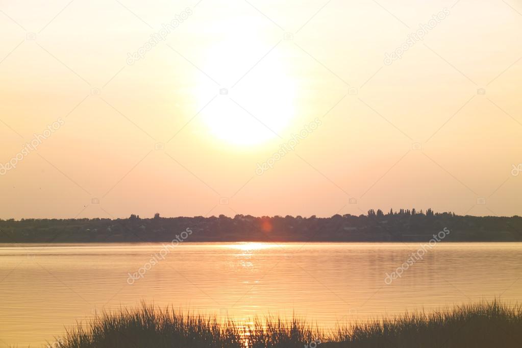 sunset over calm water