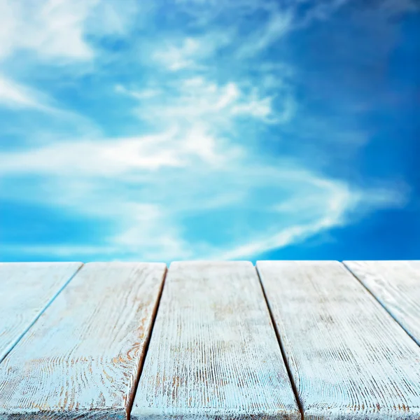 Wooden board on sky — Stock Photo, Image