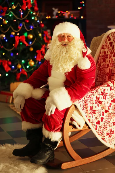 Santa Claus sitting in comfortable chair — Stock Photo, Image