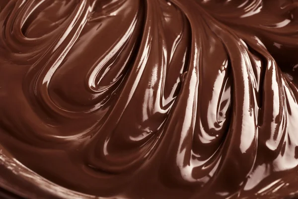 Фон из расплавленного молочного шоколада , — стоковое фото