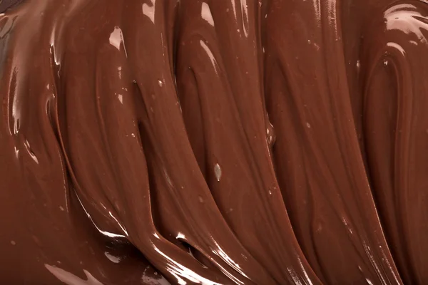 Hintergrund der geschmolzenen Milchschokolade — Stockfoto