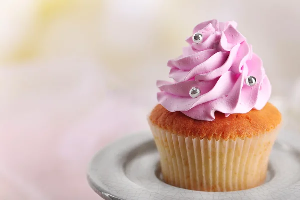 Tasty cupcake on stand — Stock Photo, Image