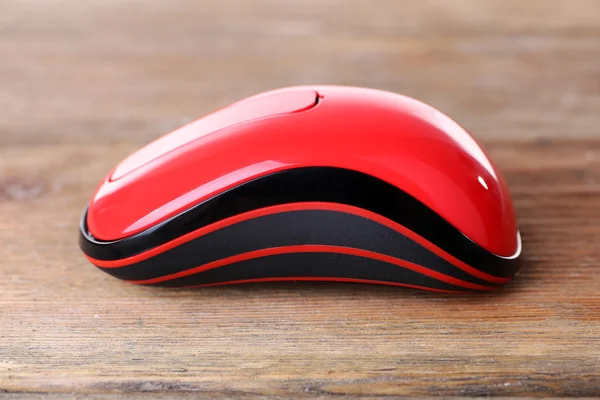 Wireless computer mouse on wooden background — Stock Photo, Image