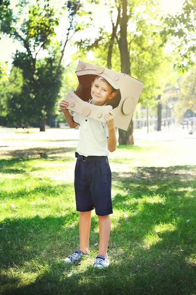 Funny boy in carton helmet — Stock Photo, Image