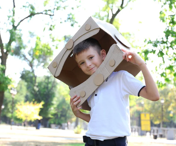 Funny boy in carton helmet — Stock Photo, Image