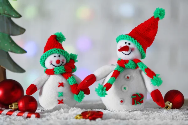 Cute snowmen on Christmas background — Stock Photo, Image