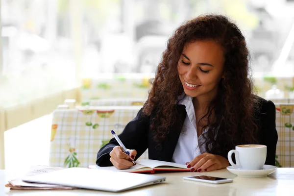 Woman at restaurant's terrace — Stock Photo, Image