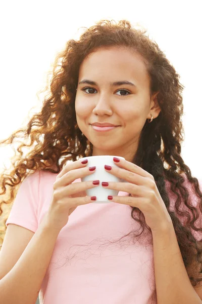 Close up portrait of pretty young woman in pink dress drinking coffee at summer terrace — Stock Photo, Image