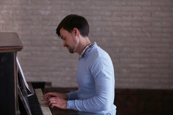 man playing piano