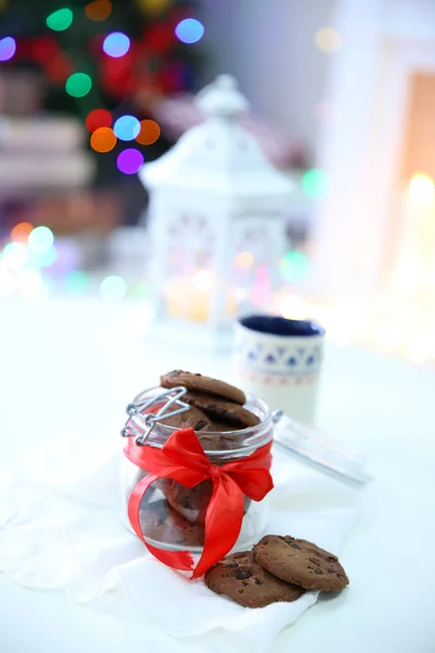 Christmas cookies and cup of tea, on table at home — Stock Photo, Image