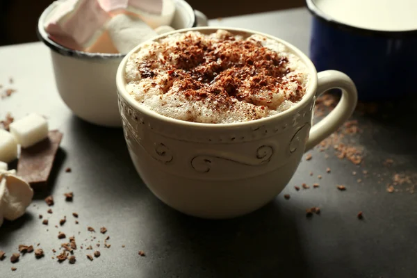 Cup of coffee with milk on a wooden table closeup — Stock Photo, Image